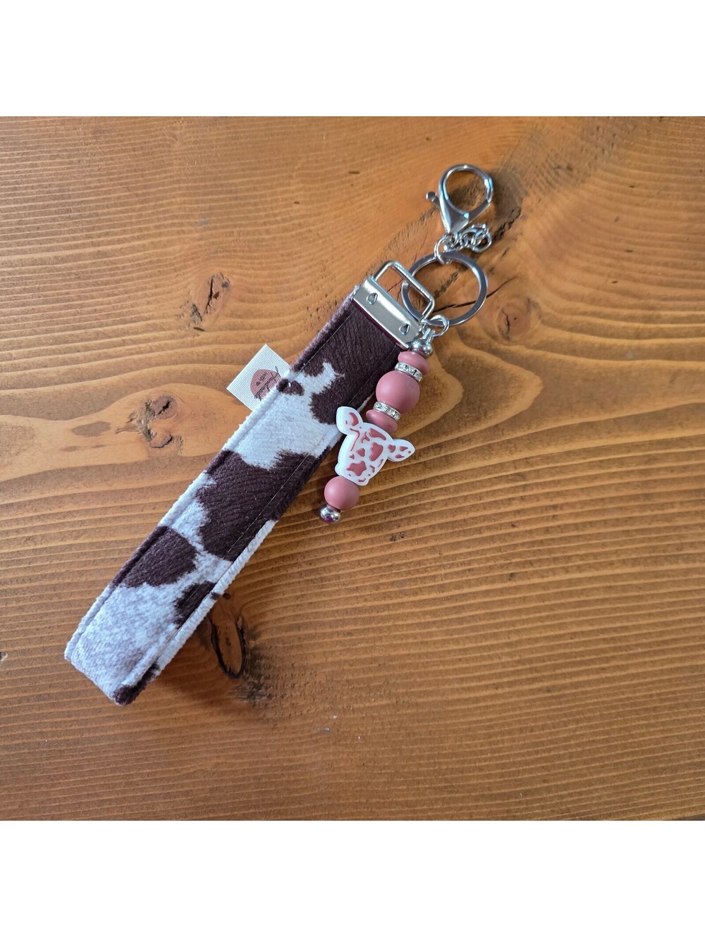 Handmade Cow Print Wristlet with Pink/Tan Highland Cow Beaded Charm